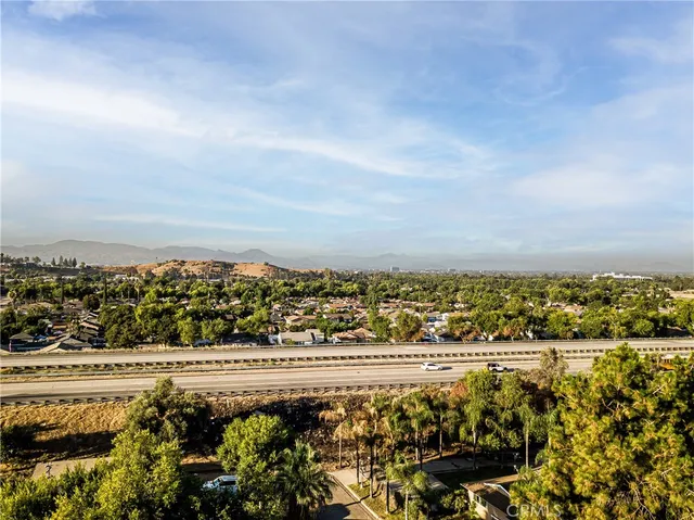 an aerial view of a house with a yard and garden