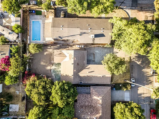 an aerial view of residential house with outdoor space and street view