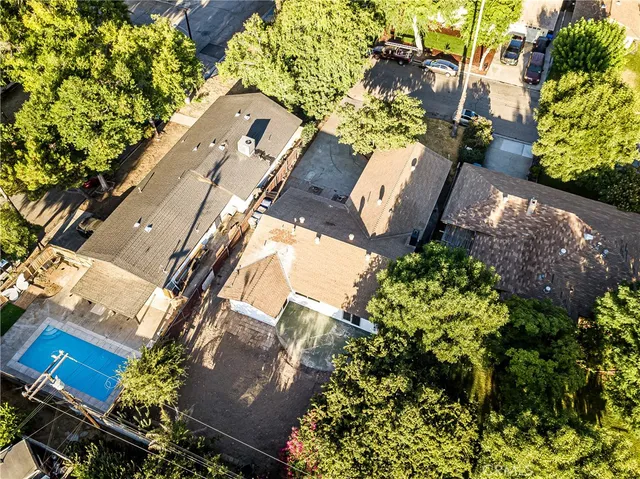 an aerial view of a house with a yard