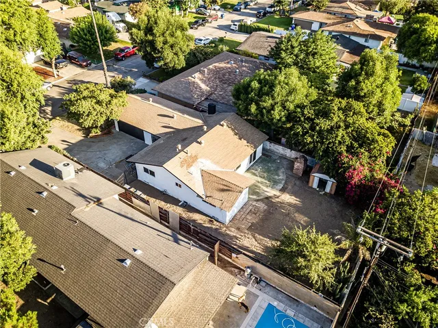 a kitchen with stainless steel appliances kitchen island a stove a refrigerator and a oven