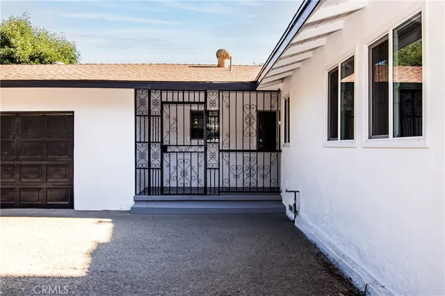 a kitchen with a refrigerator sink and cabinets