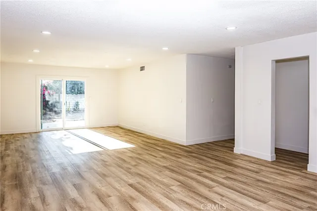a view of a big room with wooden floor