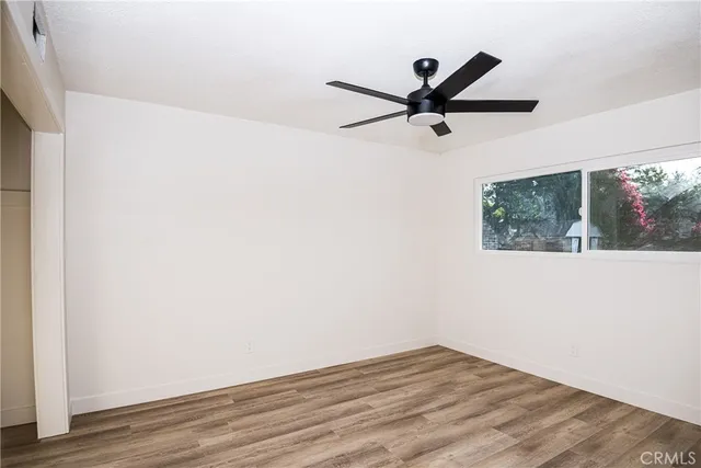 a front view of a house with a yard and a garage