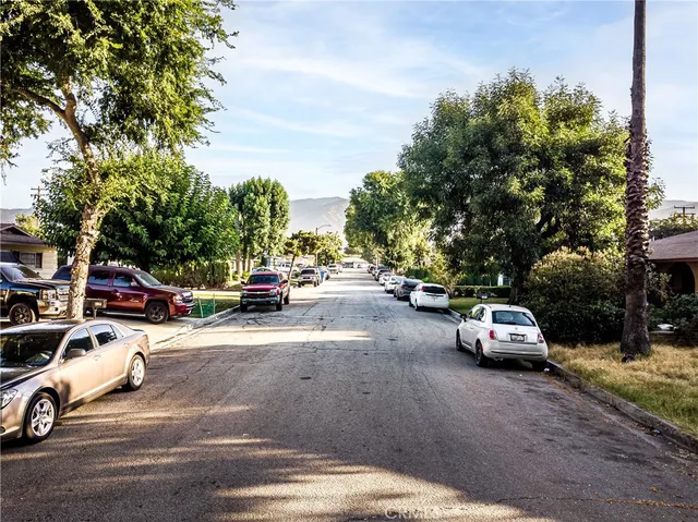 a view of a house with a tree in front of it