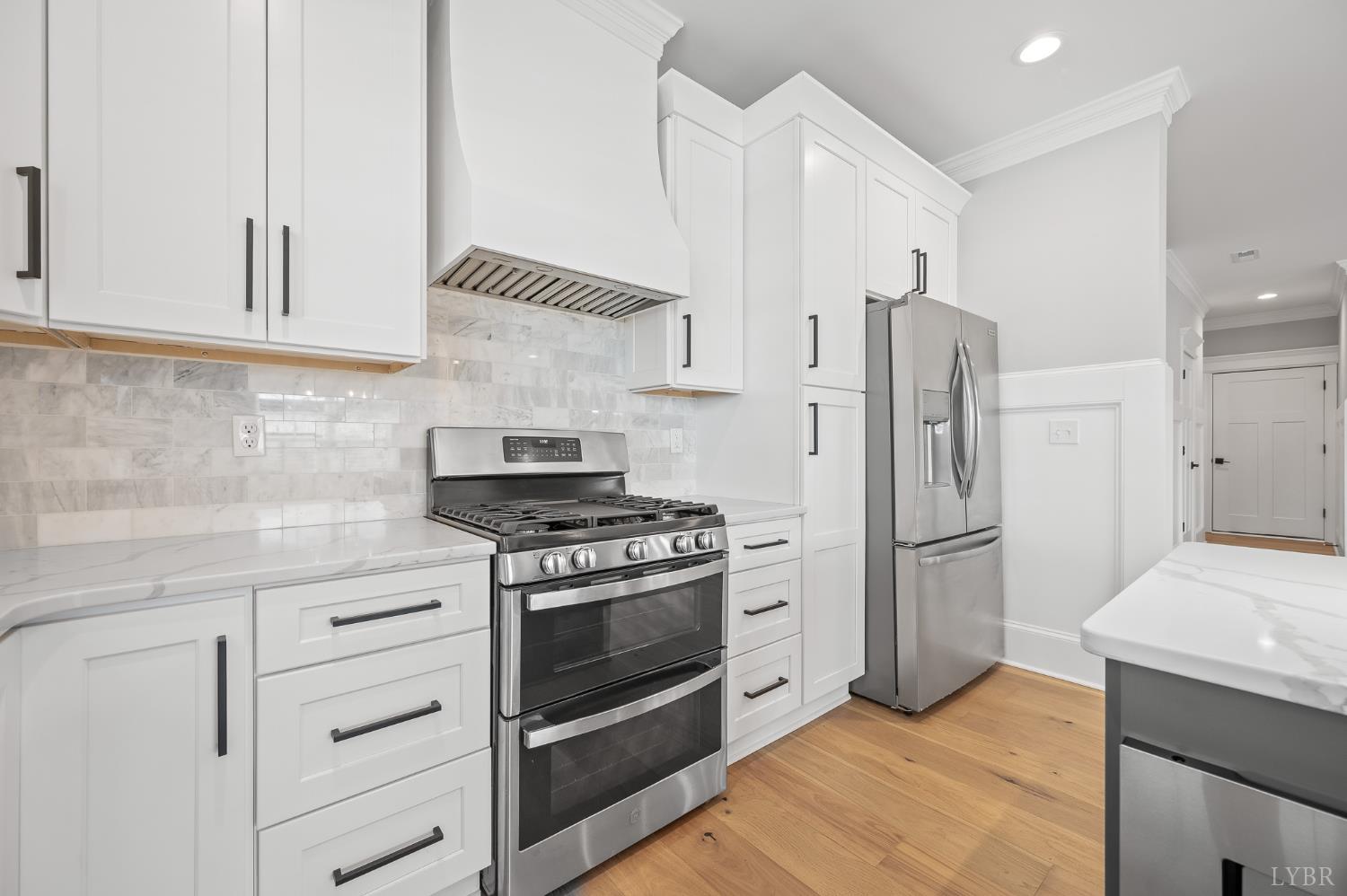 1034 North Westyn Loop Forest, VA 24551 - Photo 13 of 57 a kitchen with stainless steel appliances a stove a refrigerator and cabinets