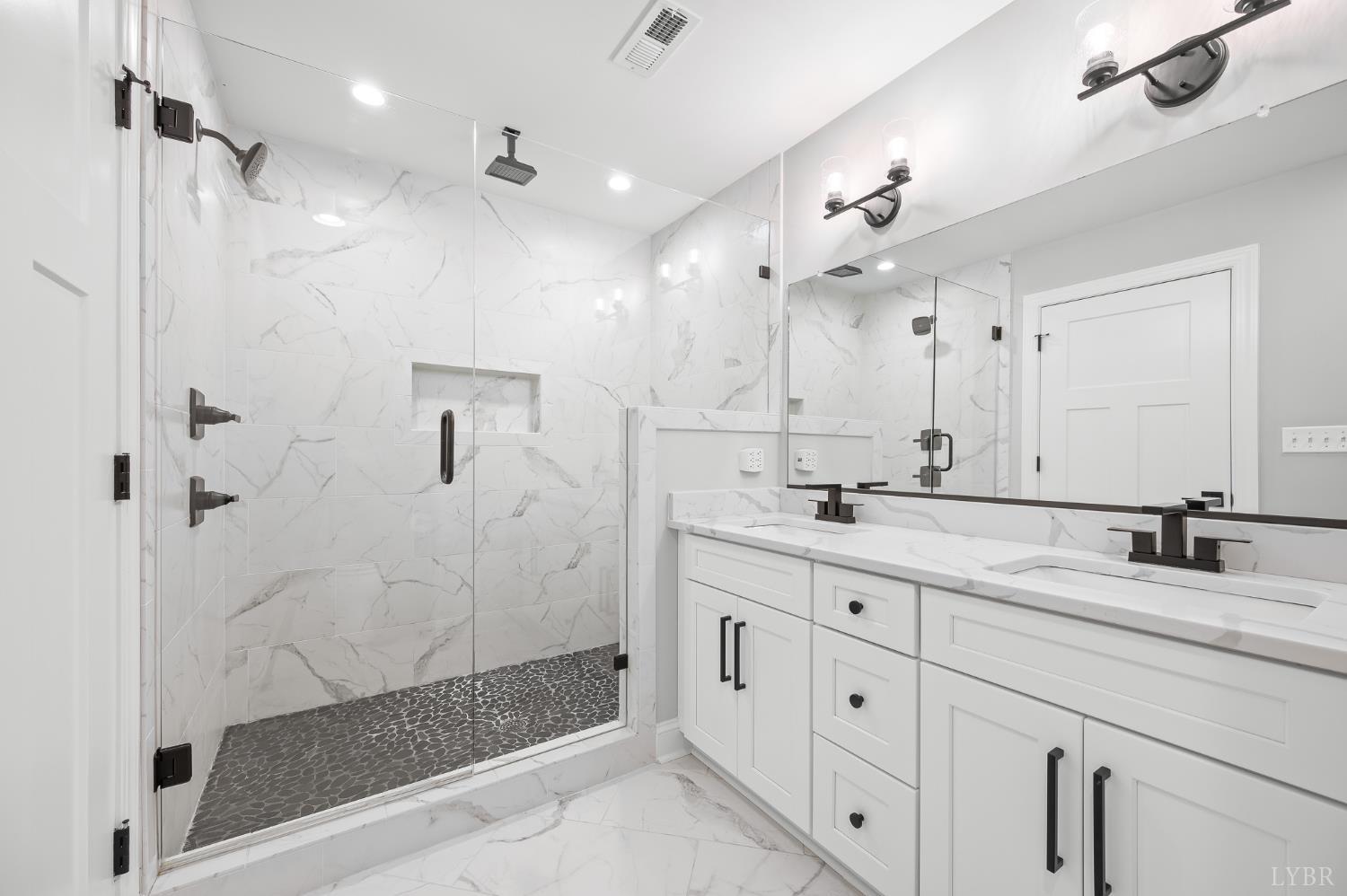 1034 North Westyn Loop Forest, VA 24551 - Photo 32 of 57 a bathroom with a granite countertop sink mirror and shower