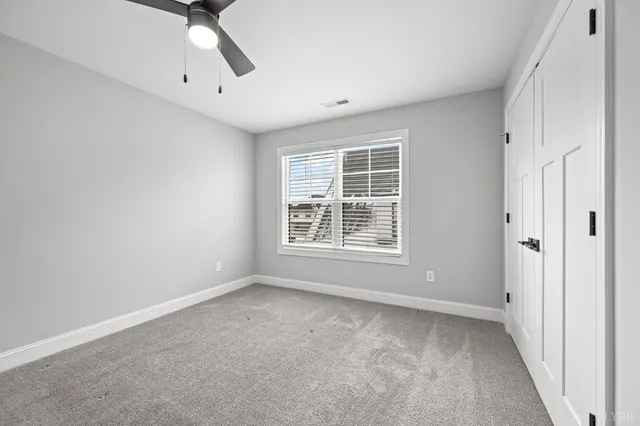 a bathroom with a toilet and a bath tub