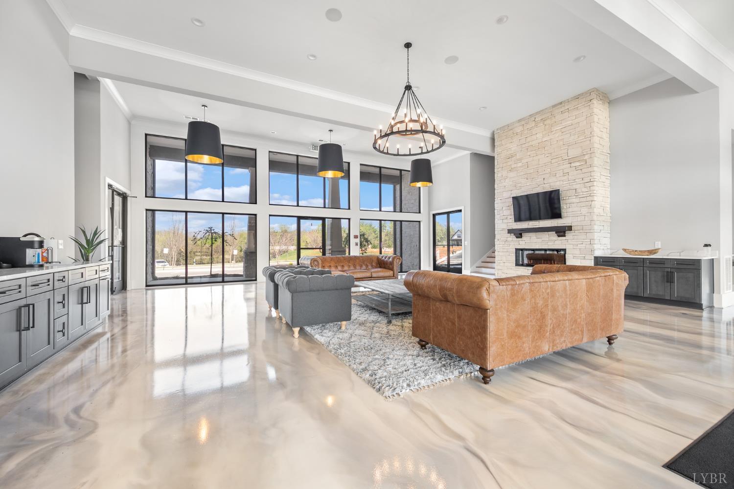 1034 North Westyn Loop Forest, VA 24551 - Photo 52 of 57 a living room with furniture wooden floor and a chandelier