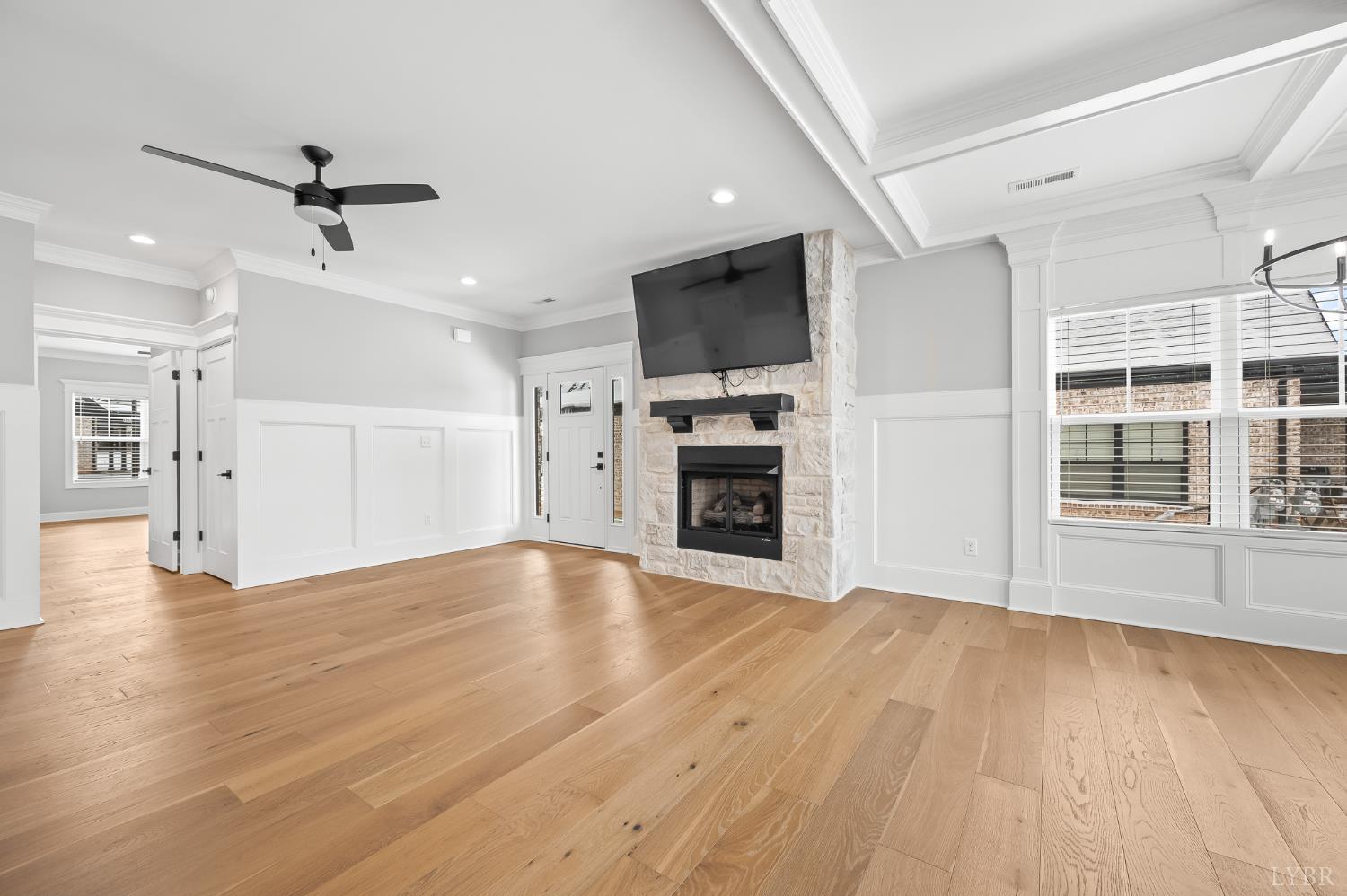 1034 North Westyn Loop Forest, VA 24551 - Photo 8 of 57 an empty room with wooden floor a ceiling fan and windows