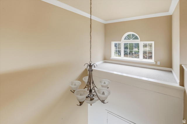 2887 View Crest Circle North Logan, UT 84341 - Photo 6 of 37 Detailed view of crown molding and a chandelier