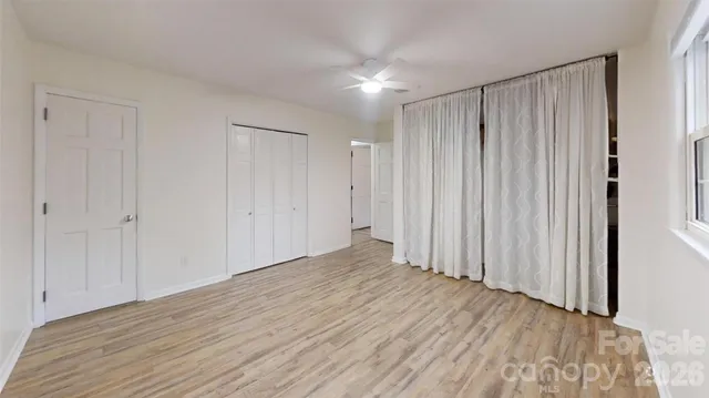 a kitchen with stove cabinets and window