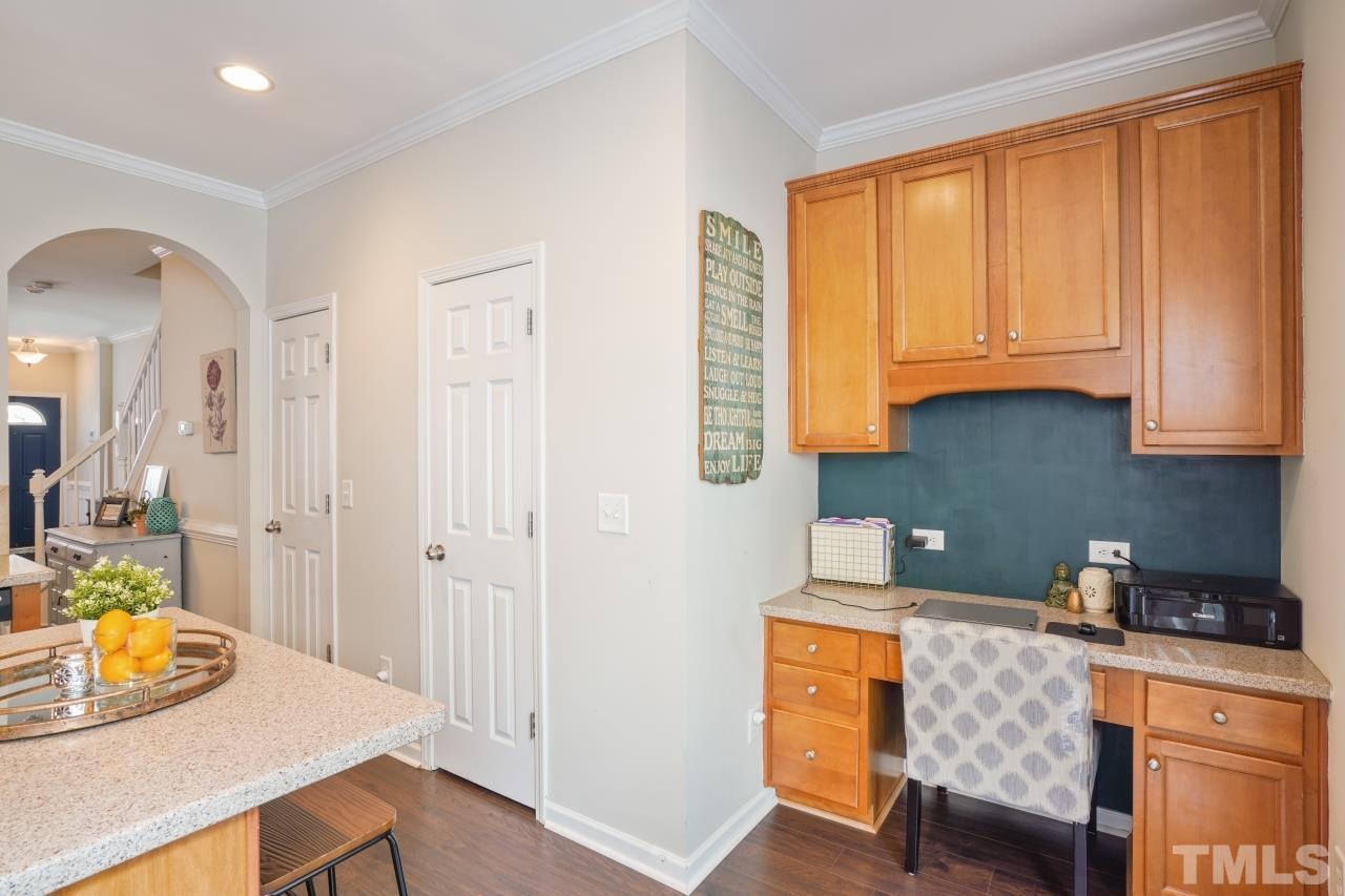 2710 Chilton Place Raleigh, NC 27616 - Photo 12 of 25 a kitchen with a sink cabinets and window