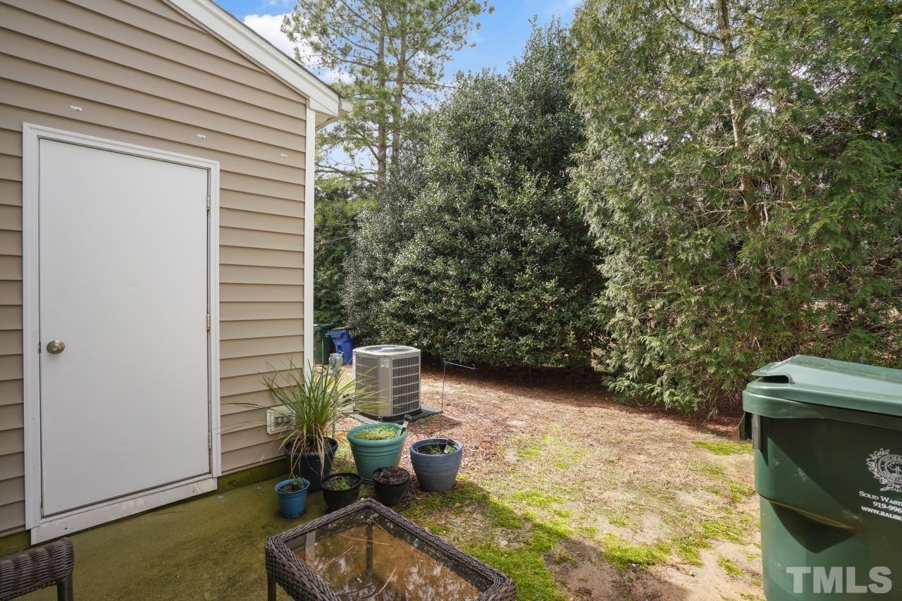 2710 Chilton Place Raleigh, NC 27616 - Photo 23 of 25 a backyard of a house with outdoor seating