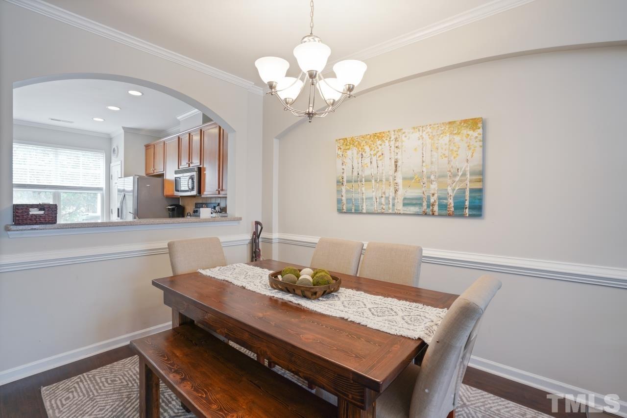 2710 Chilton Place Raleigh, NC 27616 - Photo 7 of 25 a view of a dining room with furniture window and wooden floor