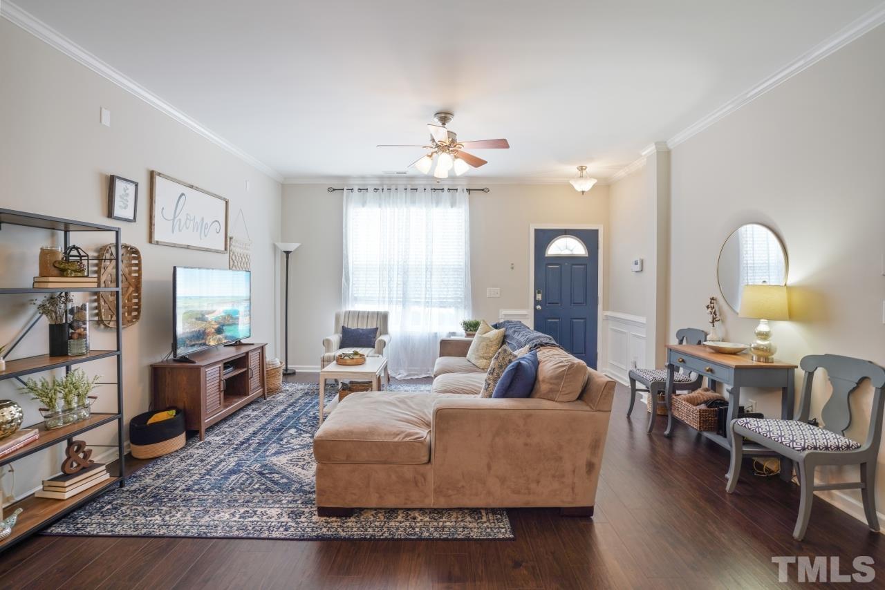 2710 Chilton Place Raleigh, NC 27616 - Photo 8 of 25 a living room with furniture and a chandelier