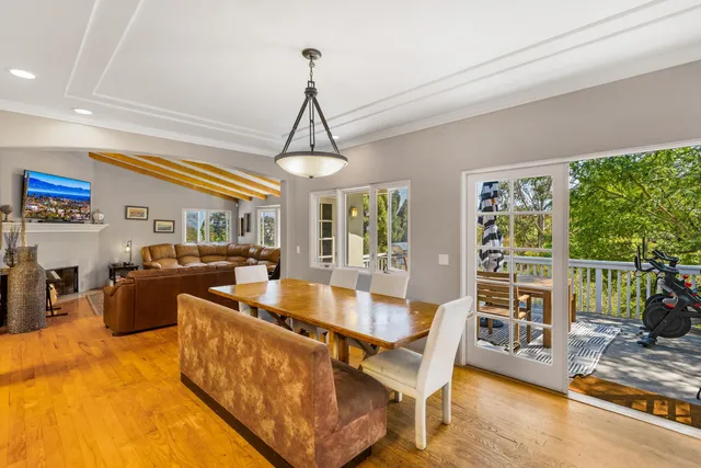 a kitchen with a refrigerator and wooden cabinets