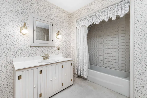 a bathroom with a sink and a mirror