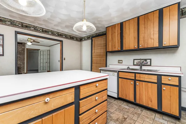 a kitchen with stainless steel appliances granite countertop a sink and cabinets