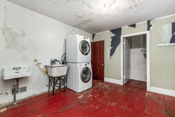 a view of storage and utility room with washer and dryer
