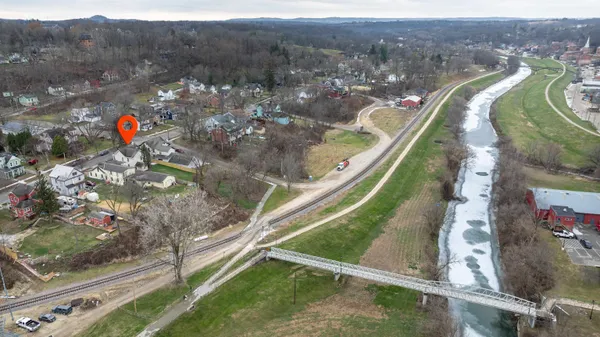 an aerial view of residential houses and outdoor space
