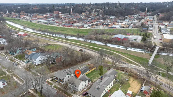 an aerial view of a house with a lake view
