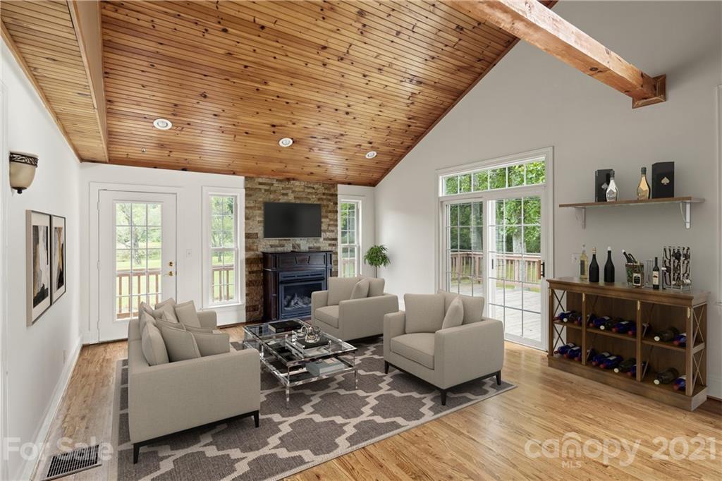 101 McFalls Road Asheville, NC 28805 - Photo 2 of 21 a living room with furniture and a fireplace