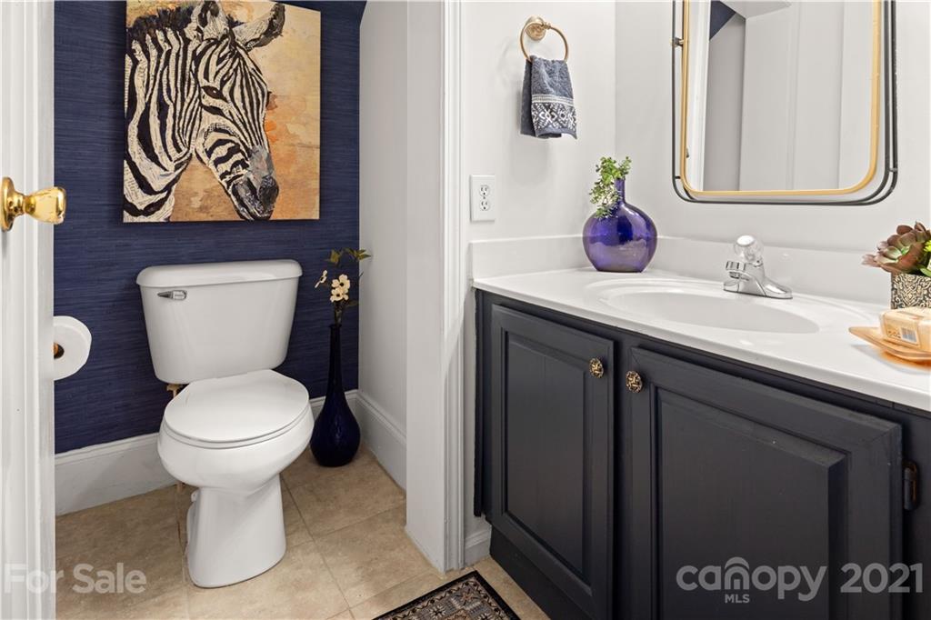 101 McFalls Road Asheville, NC 28805 - Photo 14 of 21 a bathroom with a toilet sink and mirror