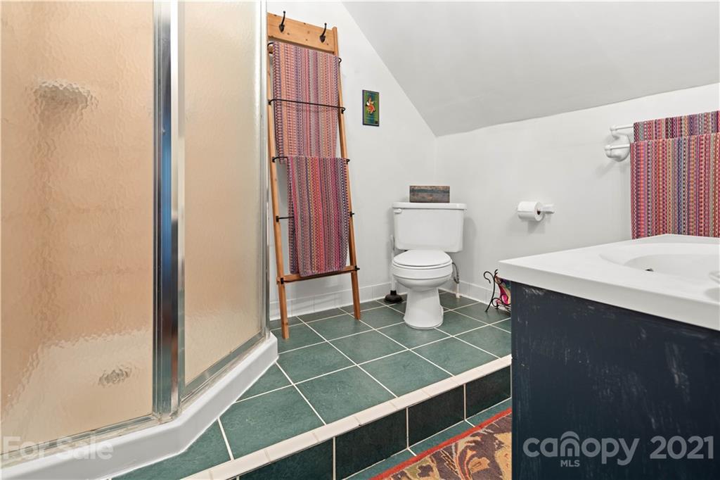 101 McFalls Road Asheville, NC 28805 - Photo 18 of 21 a bathroom with a sink and a toilet