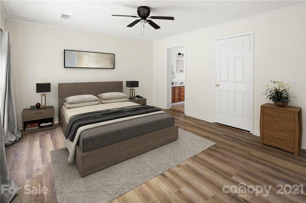 101 McFalls Road Asheville, NC 28805 - Photo 8 of 21 a bedroom with a bed and a potted plant