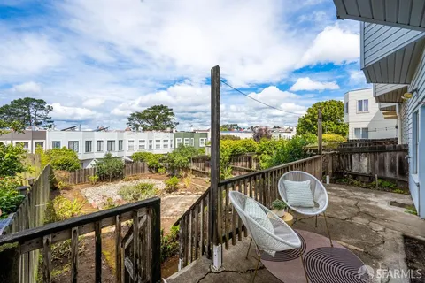 a view of a balcony with furniture