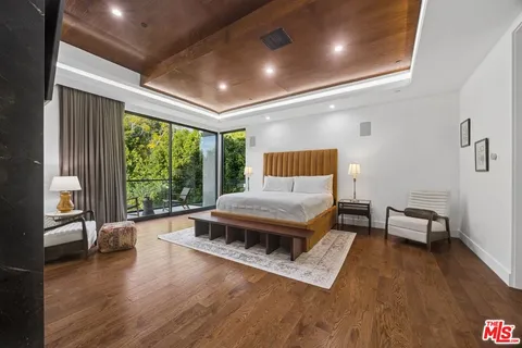 a balcony with table and chairs