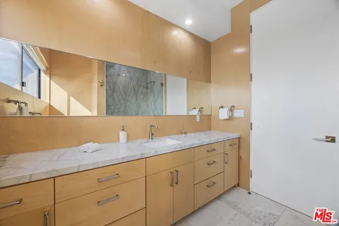 a utility room with sink dryer and washer