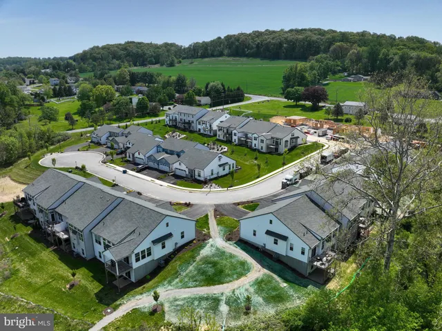 an aerial view of a house with a garden