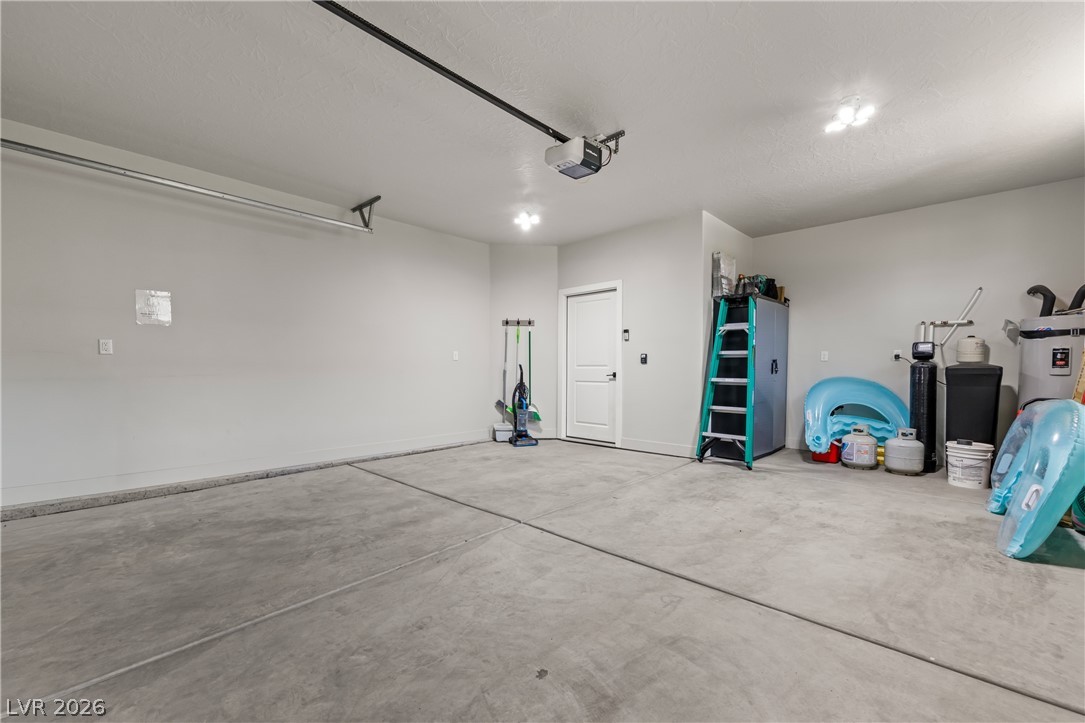 1436 Manassas Ridge Mesquite, NV 89027 - Photo 15 of 77 A spacious, well-lit garage offers ample parking and additional storage solutions.