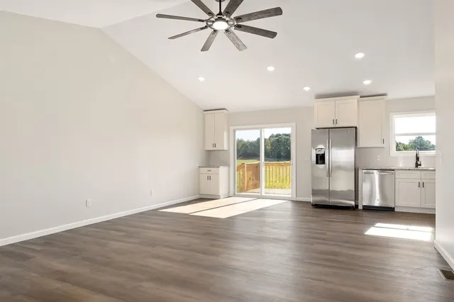 a view of a kitchen with a sink and a window