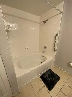 a bathroom with a bath tub and a shower
