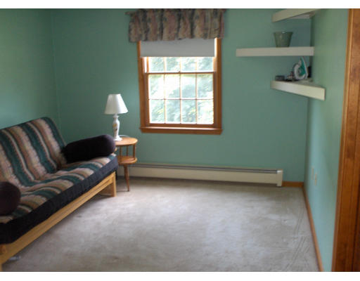 23 Great Road Maynard, MA 01754 - Photo 11 of 11 a living room with furniture and a window
