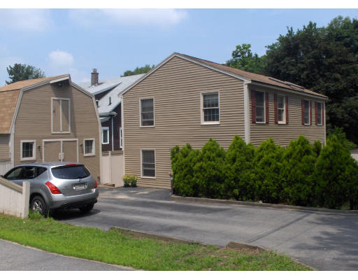 23 Great Road Maynard, MA 01754 - Photo 2 of 11 a house view with a garden space