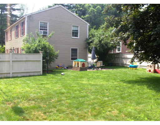 23 Great Road Maynard, MA 01754 - Photo 3 of 11 a backyard of a house with table and chairs plants and large tree