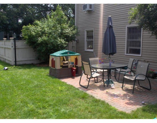 23 Great Road Maynard, MA 01754 - Photo 5 of 11 a view of a backyard with furniture