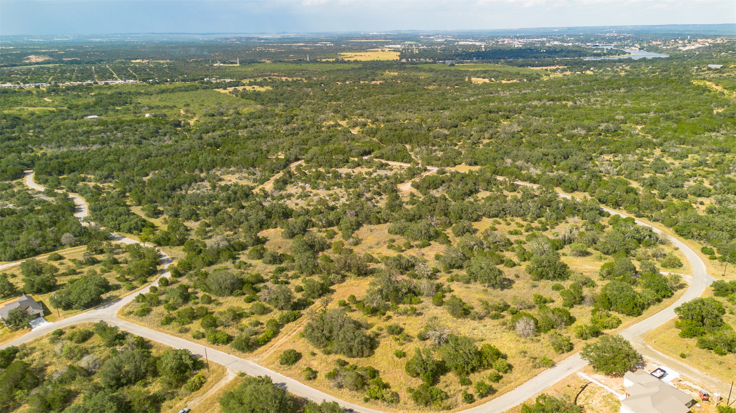 K10146 Horned Toad Road Horseshoe Bay, TX 78657 - Photo 3 of 9 an aerial view of residential houses with outdoor space