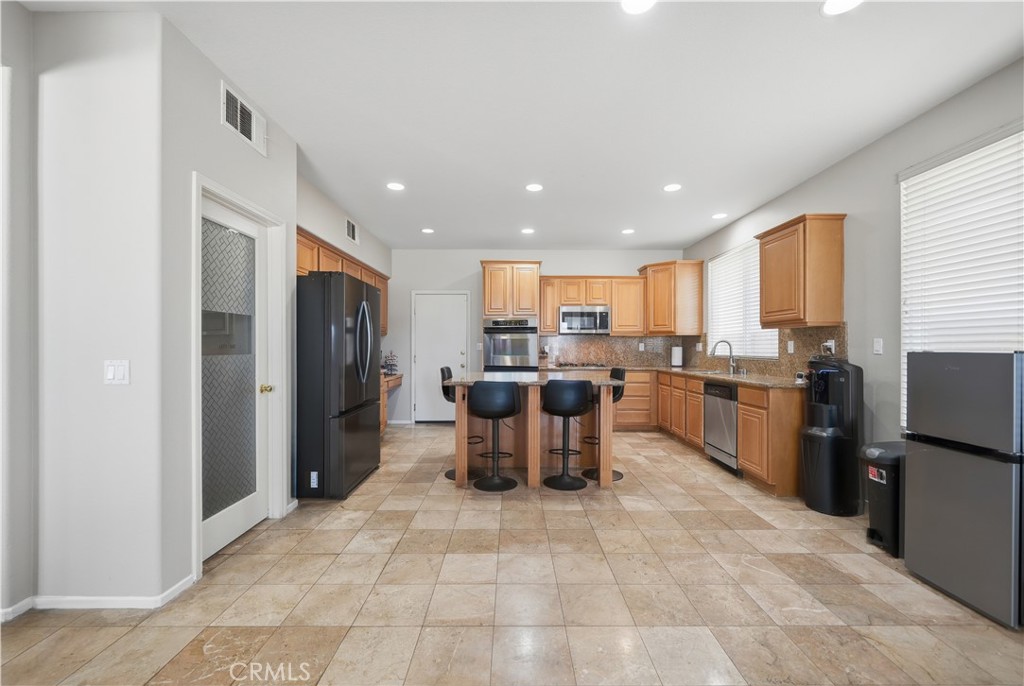 30923 Lajoe Street Menifee, CA 92584 - Photo 11 of 39 Spacious kitchen with island and walk-in pantry