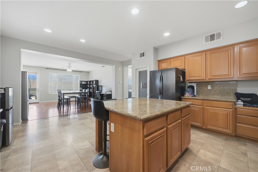 30923 Lajoe Street Menifee, CA 92584 - Photo 15 of 39 Kitchen opens to dining room