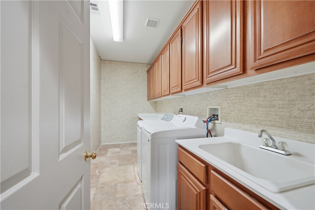30923 Lajoe Street Menifee, CA 92584 - Photo 22 of 39 Massive laundry room and generous amount of storage