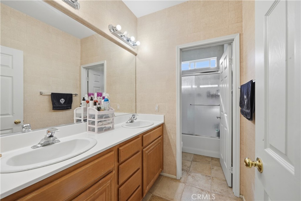 30923 Lajoe Street Menifee, CA 92584 - Photo 33 of 39 Upstairs Guest bathroom with dual sinks