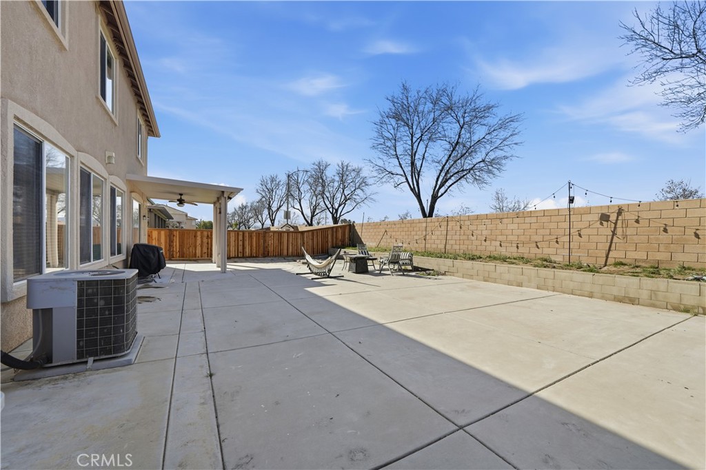 30923 Lajoe Street Menifee, CA 92584 - Photo 34 of 39 Hardscaped backyard with patio cover