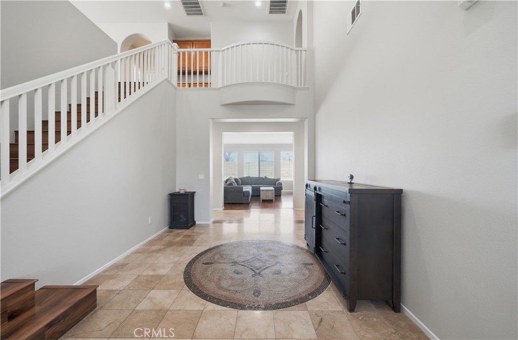 30923 Lajoe Street Menifee, CA 92584 - Photo 6 of 39 Foyer with stunning mosaic tile work and 2 story ceiling.