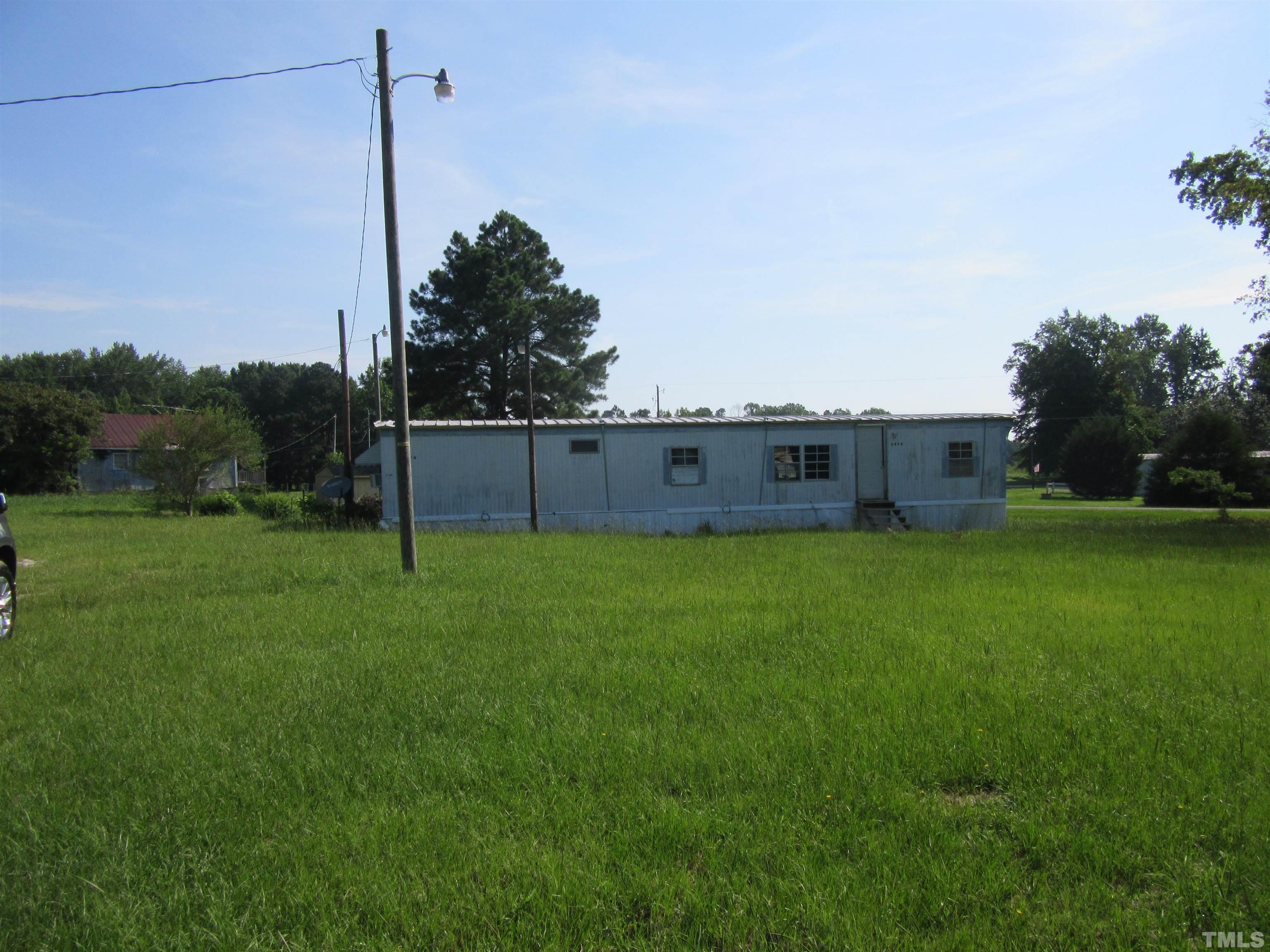 2476 Pilot-Riley Road, Unit LOT 6 Zebulon, NC 27597 - Photo 1 of 4 a view of a back yard