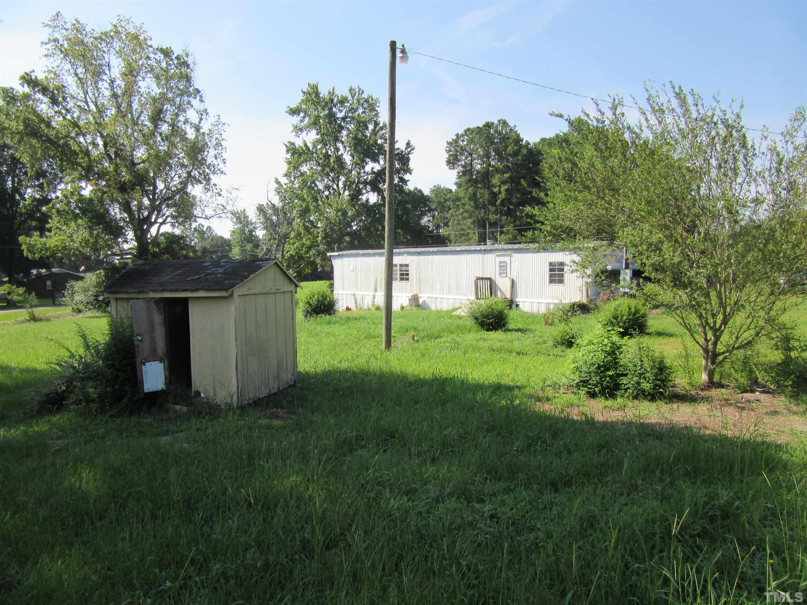 2476 Pilot-Riley Road, Unit LOT 6 Zebulon, NC 27597 - Photo 4 of 4 a view of a tiny house with a park