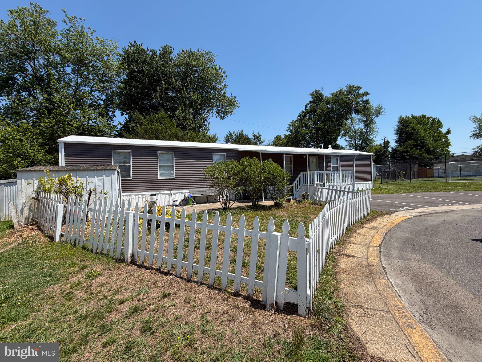 7923 Stork Road Alexandria, VA 22306 - Photo 3 of 17 Charming home with white picket fence.